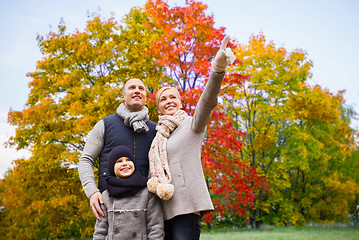 Image showing happy family over autumn park background