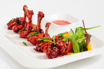 Image showing fried chicken wings in pomegranate sauce