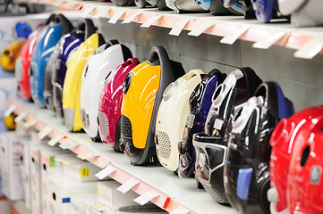 Image showing vacuum cleaners in appliance store arranged in a row