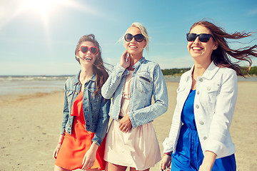 Image showing group of smiling young female friends on beach