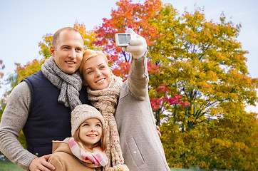 Image showing family taking selfie by camera in autumn park