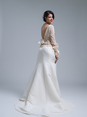 Image showing Rear view of a beautiful young woman in a wedding dress