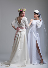Image showing Portrait of two beautiful young bride in wedding dresses