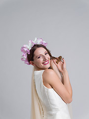 Image showing young bride in a wedding dress with a veil