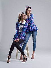 Image showing two Fashion Model girls isolated over white background