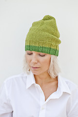 Image showing Beautiful young woman in warm green hat.