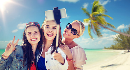 Image showing group of smiling women taking selfie on beach