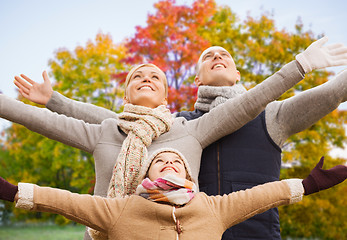 Image showing happy family over autumn park background