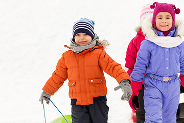 Image showing happy little kids with sleds in winter