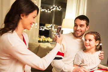 Image showing happy family taking picture at christmas dinner