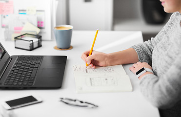 Image showing web designer working on user interface at office