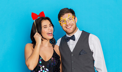 Image showing happy couple with party props having fun