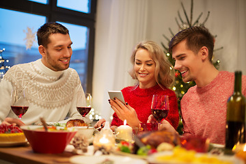 Image showing friends with cellphone celebrate christmas at home