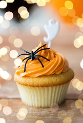 Image showing cupcake with halloween decoration on table