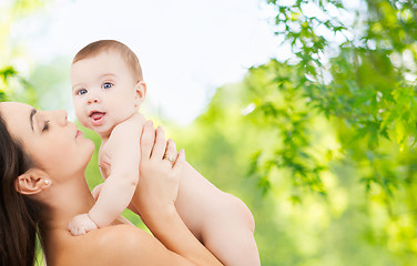 Image showing mother with baby over green natural background