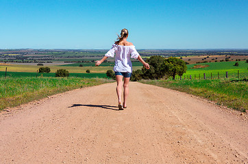 Image showing Walking along dusty country roads