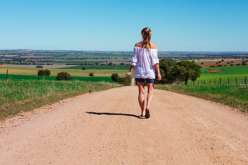 Image showing Walking along country roads