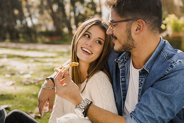 Image showing Couple eating pizza