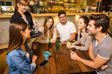 Image showing Talking to the waitress