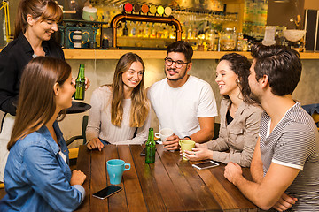 Image showing Talking to the waitress