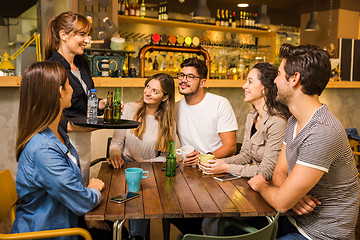 Image showing Talking to the waitress