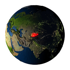 Image showing Kyrgyzstan in red on Earth isolated on white
