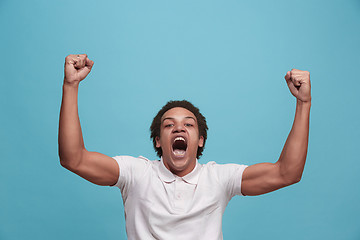 Image showing Winning success man happy ecstatic celebrating being a winner. Dynamic energetic image of male model