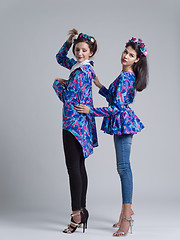 Image showing two Fashion Model girls isolated over white background