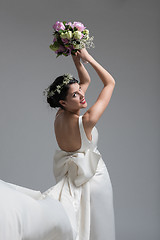 Image showing bride with a bouquet  isolated on white background