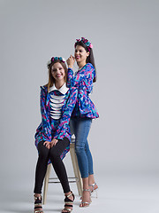 Image showing two Fashion Model girls isolated over white background