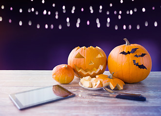 Image showing halloween jack-o-lantern, pumpkins and tablet pc