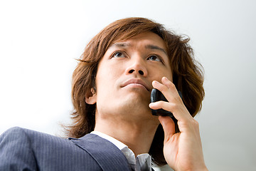 Image showing Asian business man and phone