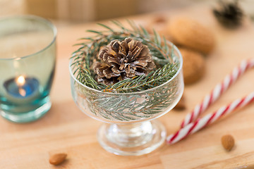 Image showing christmas fir decoration with cone in dessert bowl