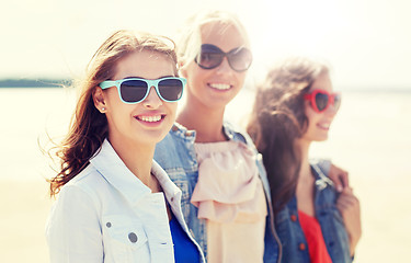 Image showing group of smiling women in sunglasses on beach