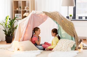 Image showing little girls talking in kids tent at home