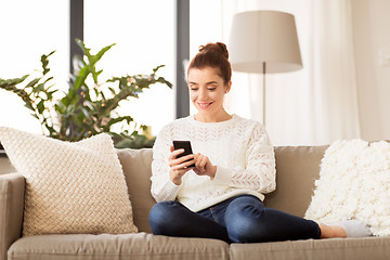 Image showing woman with smartphone at home