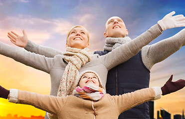 Image showing happy family over sunset in tallinn city in autumn