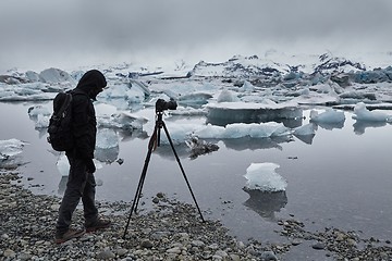 Image showing Photographer with tripod