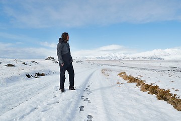 Image showing Man standing on snowy landscpe