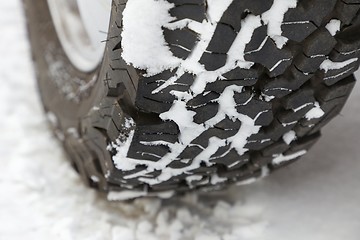 Image showing Car tyre in snow