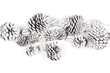 Image showing White decorative pine cones and balls.
