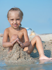 Image showing Little girl on sandy beach