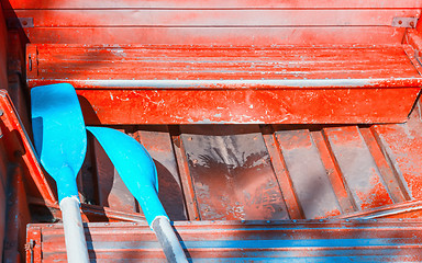 Image showing Oars In An Old Red Boat Close-up