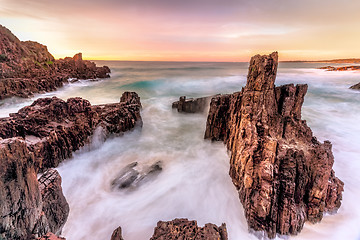 Image showing Sea stack views and ocean flows amazing sunrise