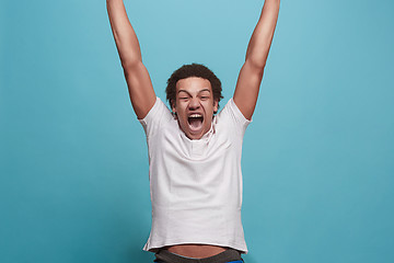 Image showing Winning success man happy ecstatic celebrating being a winner. Dynamic energetic image of male model