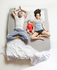 Image showing Top view of happy family with one newborn child in bedroom.