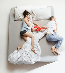 Image showing Top view of happy family with one newborn child in bedroom.