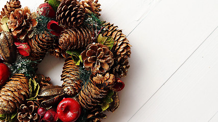 Image showing Christmas Wreath on White Wooden Background