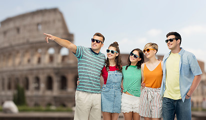 Image showing friends in sunglasses over coliseum background