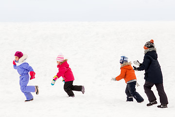 Image showing happy little kids playing outdoors in winter